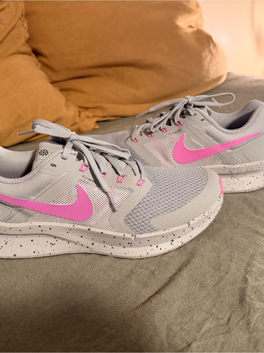 Nike Women's Light Gray Running Sneakers with Pink Swoosh